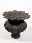 This contemporary ceramic vessel was inspired by nature and rendered in black. Image 2