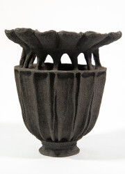 This contemporary ceramic vessel was inspired by nature and rendered in black.