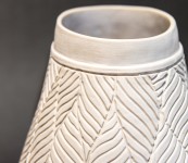 This delicately detailed vase in a creamy white is by Loren Kaplan. Image 4