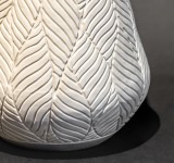 This delicately detailed vase in a creamy white is by Loren Kaplan. Image 3