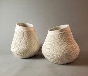 This delicately detailed vase in a creamy white is by Loren Kaplan. Image 5