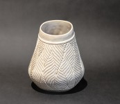 This delicately detailed vase in a creamy white is by Loren Kaplan. Image 2