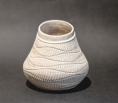 This delicately detailed vase in a creamy white is by Loren Kaplan. Image 2