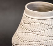 This delicately detailed vase in a creamy white is by Loren Kaplan. Image 4