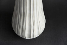 This contemporary white ceramic vessel is handmade. Image 3