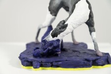 A cast resin figurine of a hound who has hunted a fox, which in turn has hunted a goose is patinated in indigo, black and white by emerging … Image 2