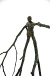 This indoor figurative tabletop bronze sculpture is made by Canadian artist Roch Smith. Image 3