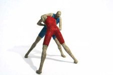 Two figures wrestle in this playful paper mache sculpture by Paul Duval. Image 2