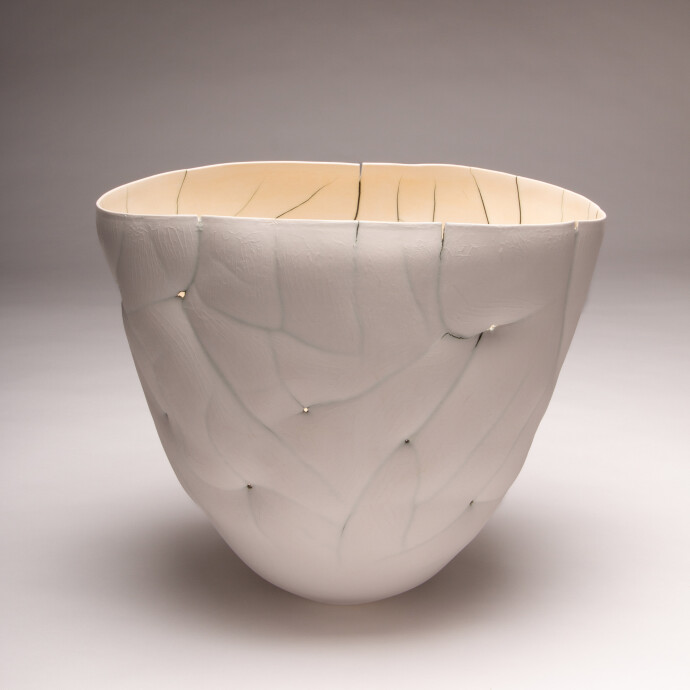 This white ceramic vessel’s organic shape was inspired by nature.