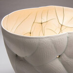 This white ceramic vessel’s organic shape was inspired by nature. Image 7