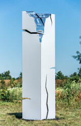 A pillar of stainless steel is coated white in this minimalist outdoor sculpture by Philippe Pallafray.