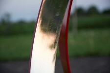 This elegant contemporary outdoor sculpture in bright poppy red was hand-forged from stainless steel by Philippe Pallafray. Image 4