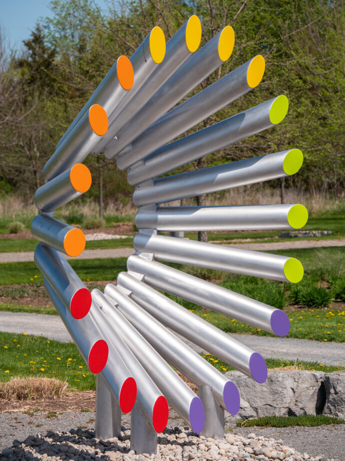 This modern contemporary outdoor sculpture is forged from steel in an abstract form.