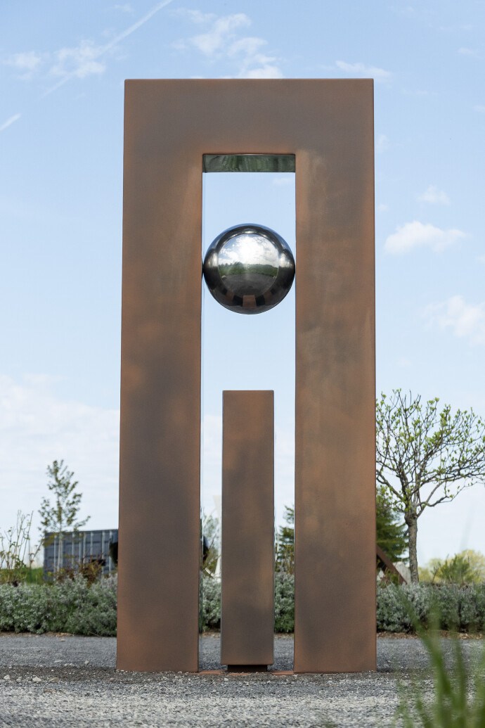 This contemporary sculpture is forged from stainless steel and designed for the outdoors.