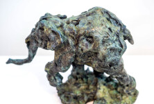 This delightful bronze statuette of a walking baby elephant is highly textured and finished with an elegant sepia patina. Image 8