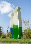 Reminiscent of the angles and form found in origami, this intriguing sculpture stands tall against the sky. Image 4