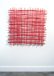 A layered grid of intersecting lengths of bent aluminum is painted in an eye-popping primary red by Shayne Dark. Image 2