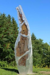 An organic shape rises from the ground and reaches for the sky in this finely crafted aluminum sculpture by Stephane Langlois.