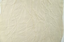 This contemporary embossed print in white is inspired by nature. Image 3