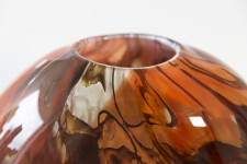 This beautiful deep red vessel in blown glass takes its organic shape and wild patterns from nature. Image 5