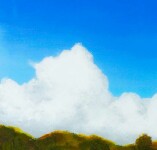 An intense Mediterranean blue sky above billowing cumulus clouds presses down on a rapidly moving river framed by a landscape of ochre, cypr… Image 2