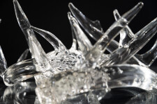 The distinctive and elegant shape of deer antlers emerges from hand-blown translucent glass to create this contemporary tabletop sculpture b… Image 2