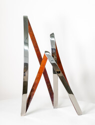 This elegant and dynamic contemporary stainless steel sculpture was created by Ulysses Veloso to emulate the warmth and shape of a bonfire.