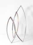 This elegant and dynamic contemporary stainless steel sculpture was created by Ulysses Veloso to emulate the warmth and shape of a bonfire. Image 4